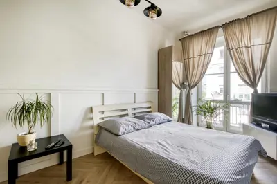 Łóżko lub łóżka w pokoju w obiekcie Studio Marszałkowska