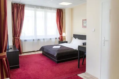 Łóżko lub łóżka w pokoju w obiekcie SCSK Żurawia