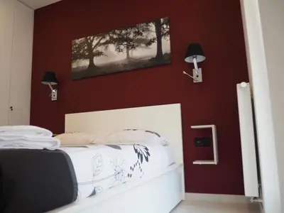 Łóżko lub łóżka w pokoju w obiekcie Apartament Kapelanów