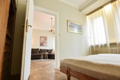 Łóżko lub łóżka w pokoju w obiekcie Smulikowskiego 9