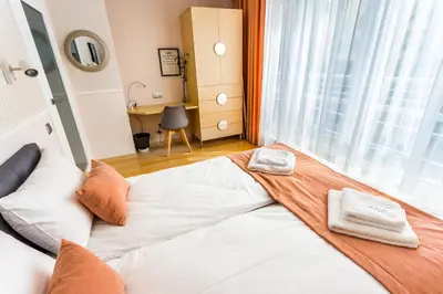 Łóżko lub łóżka w pokoju w obiekcie JessApart– Babka Tower Apartment