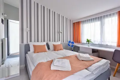 Łóżko lub łóżka w pokoju w obiekcie JessApart– Babka Tower Apartment