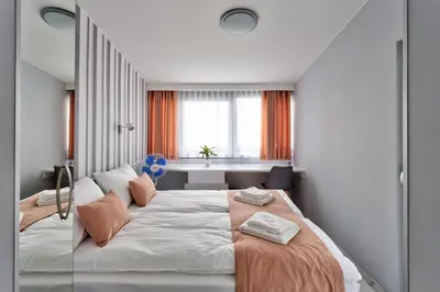 Łóżko lub łóżka w pokoju w obiekcie JessApart– Babka Tower Apartment