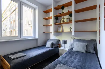 Łóżko lub łóżka w pokoju w obiekcie Apartament Centrum Twarda