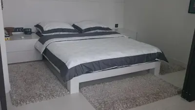 Łóżko lub łóżka w pokoju w obiekcie Okolnik Apartment
