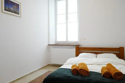 Łóżko lub łóżka w pokoju w obiekcie Apartment In the Heart of Warsaw