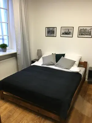 Łóżko lub łóżka w pokoju w obiekcie Cichy Apartament na Nowym Świecie