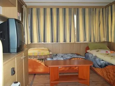 Łóżko lub łóżka w pokoju w obiekcie Camping domki letniskowe