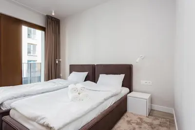 Łóżko lub łóżka w pokoju w obiekcie Platinum Residence Mokotów