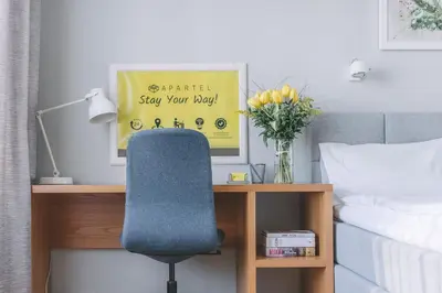 Łóżko lub łóżka w pokoju w obiekcie APARTEL Plac Unii Lubelskiej