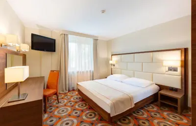Łóżko lub łóżka w pokoju w obiekcie Hotel Boss