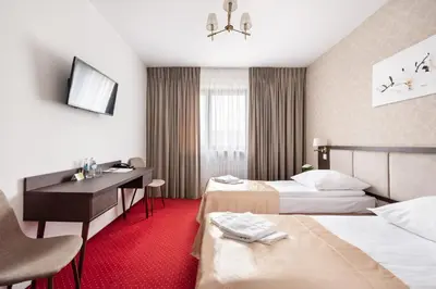 Łóżko lub łóżka w pokoju w obiekcie Hotel Arkadia