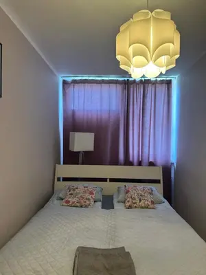 Łóżko lub łóżka w pokoju w obiekcie Coser Apartamenty Centrum