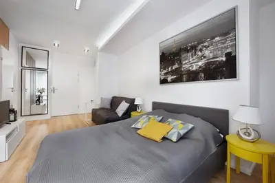 Łóżko lub łóżka w pokoju w obiekcie SilverApartments