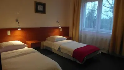 Łóżko lub łóżka w pokoju w obiekcie Hotel Julianów
