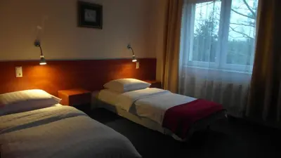 Łóżko lub łóżka w pokoju w obiekcie Hotel Julianów