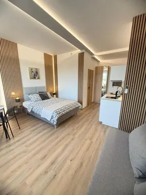 Łóżko lub łóżka w pokoju w obiekcie Exclusive Apartments Smolna
