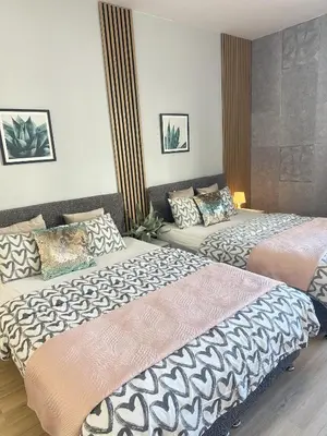 Łóżko lub łóżka w pokoju w obiekcie Exclusive Apartments Smolna
