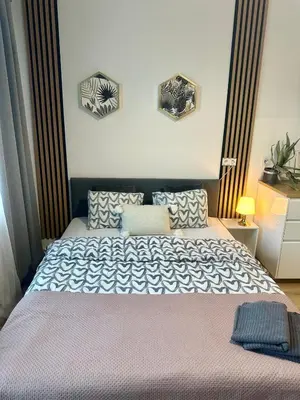 Łóżko lub łóżka w pokoju w obiekcie Exclusive Apartments Smolna