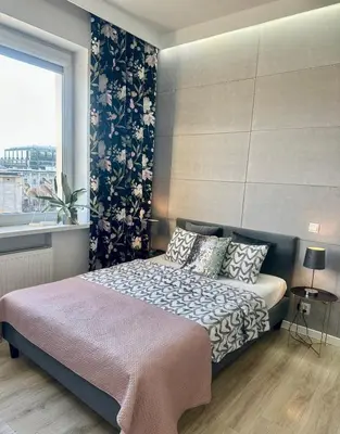 Łóżko lub łóżka w pokoju w obiekcie Exclusive Apartments Smolna