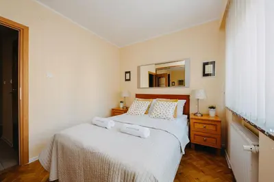 Łóżko lub łóżka w pokoju w obiekcie ShortStayPoland Warecka (B2)