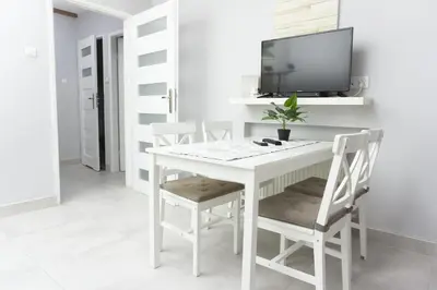 Telewizja i/lub zestaw kina domowego w obiekcie Sleep4you Apartamenty Centrum
