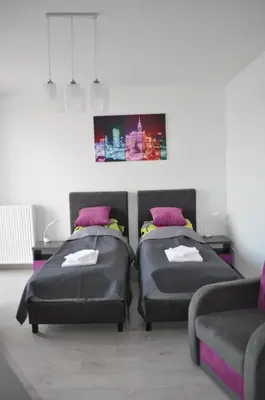 Łóżko lub łóżka w pokoju w obiekcie Pop Art Apartments
