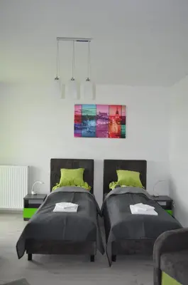 Łóżko lub łóżka w pokoju w obiekcie Pop Art Apartments