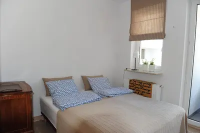 Łóżko lub łóżka w pokoju w obiekcie Żeromskiego 1