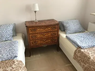 Łóżko lub łóżka w pokoju w obiekcie Żeromskiego 1