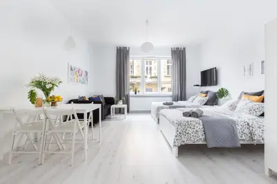 Łóżko lub łóżka w pokoju w obiekcie Palm Aparts Warsaw