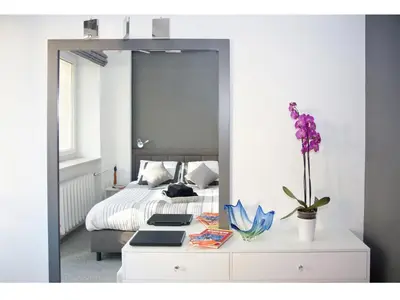 Łóżko lub łóżka w pokoju w obiekcie Kredytowa Warsaw Apartment