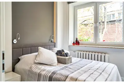 Łóżko lub łóżka w pokoju w obiekcie Kredytowa Warsaw Apartment