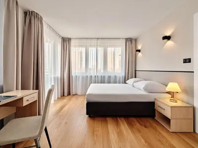 Łóżko lub łóżka w pokoju w obiekcie Apartamenty Media Park