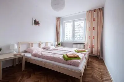 Łóżko lub łóżka w pokoju w obiekcie Center Warsaw - Apartament Jana Pawła