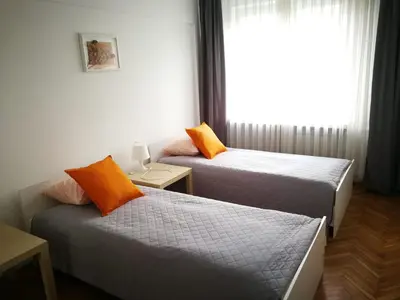 Łóżko lub łóżka w pokoju w obiekcie Center Warsaw - Apartament Jana Pawła