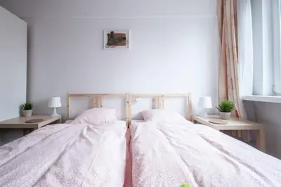 Łóżko lub łóżka w pokoju w obiekcie Center Warsaw - Apartament Jana Pawła
