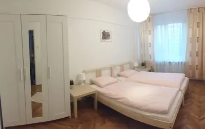 Łóżko lub łóżka w pokoju w obiekcie Center Warsaw - Apartament Jana Pawła