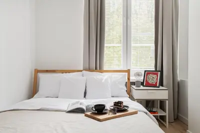 Łóżko lub łóżka w pokoju w obiekcie oompH Warsaw Nowy Swiat Apartment
