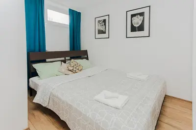 Łóżko lub łóżka w pokoju w obiekcie ShortStayPoland Grzybowska (B1)