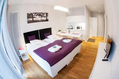 Łóżko lub łóżka w pokoju w obiekcie Triton Apartments in Warsaw