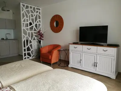 Telewizja i/lub zestaw kina domowego w obiekcie Manhattan Place Apartament