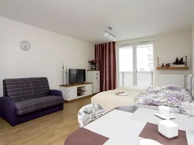 Telewizja i/lub zestaw kina domowego w obiekcie Manhattan Place Apartament
