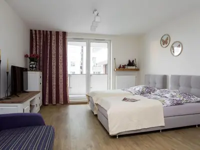 Łóżko lub łóżka w pokoju w obiekcie Manhattan Place Apartament