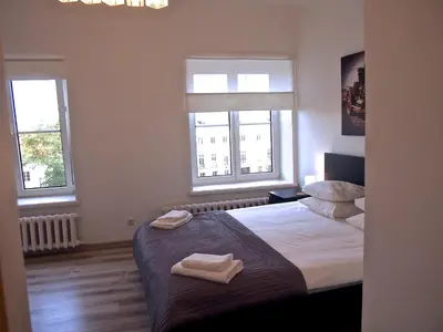 Łóżko lub łóżka w pokoju w obiekcie Royal Way Snug - Old Town