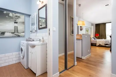 Łóżko lub łóżka w pokoju w obiekcie Apartament Triton Park