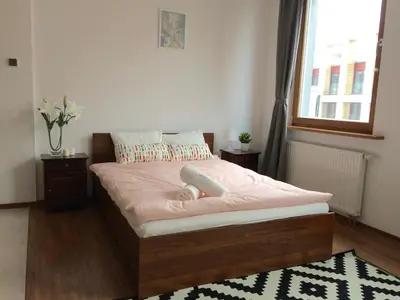 Łóżko lub łóżka w pokoju w obiekcie Luxury apartment Piękna