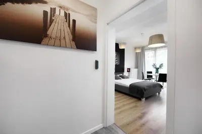 Łóżko lub łóżka w pokoju w obiekcie Kalia Apartments