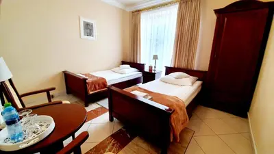 Łóżko lub łóżka w pokoju w obiekcie BTHouse, Pokoje Gościnne