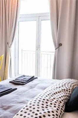 Łóżko lub łóżka w pokoju w obiekcie Marszałkowska Apartament 138
